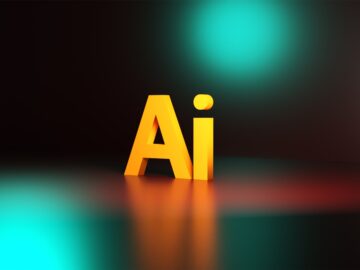 a yellow letter sitting on top of a black floor